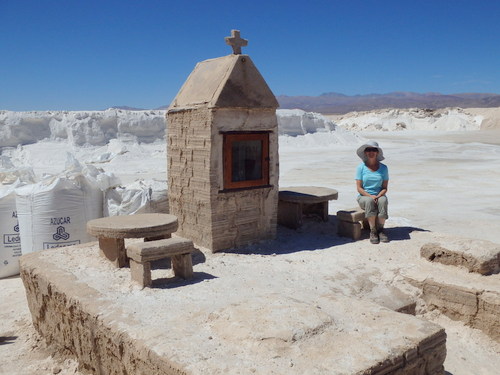 Terry sits at a Religious Shrine made of Salt.